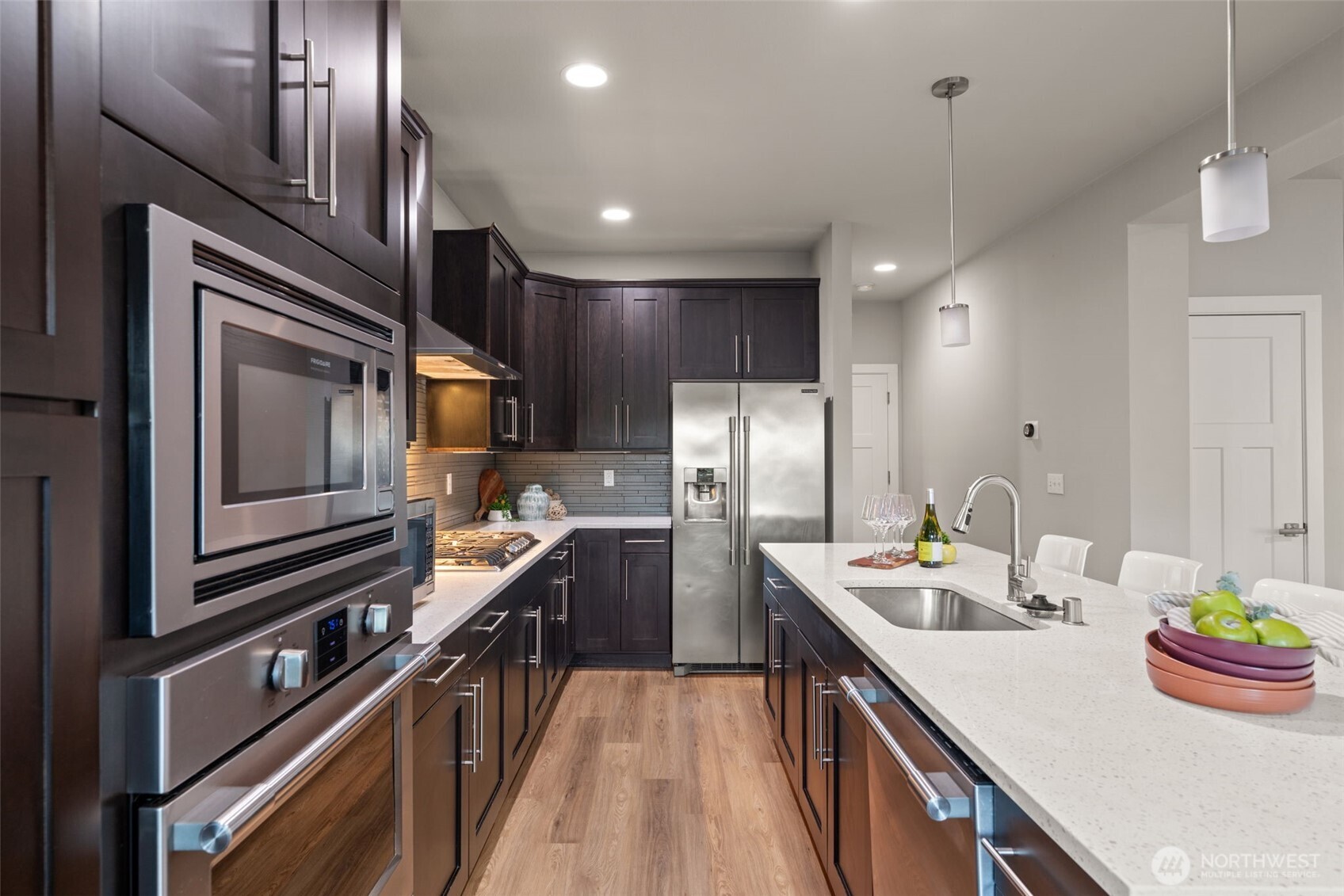 4408 214th Place Southeast Bothell, WA 98021 - Photo 18 of 33 a kitchen with refrigerator cabinets and stove