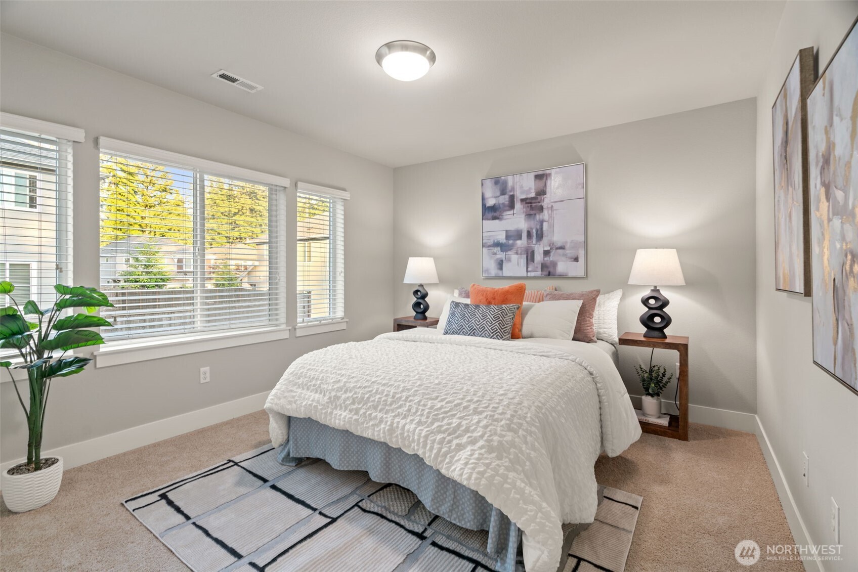 4408 214th Place Southeast Bothell, WA 98021 - Photo 22 of 33 a bed room with a bed and a potted plant