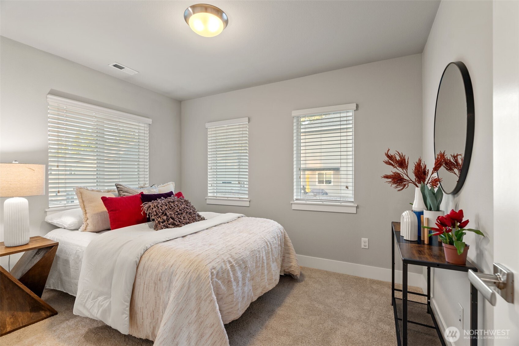 4408 214th Place Southeast Bothell, WA 98021 - Photo 23 of 33 a bedroom with bed and a potted plant