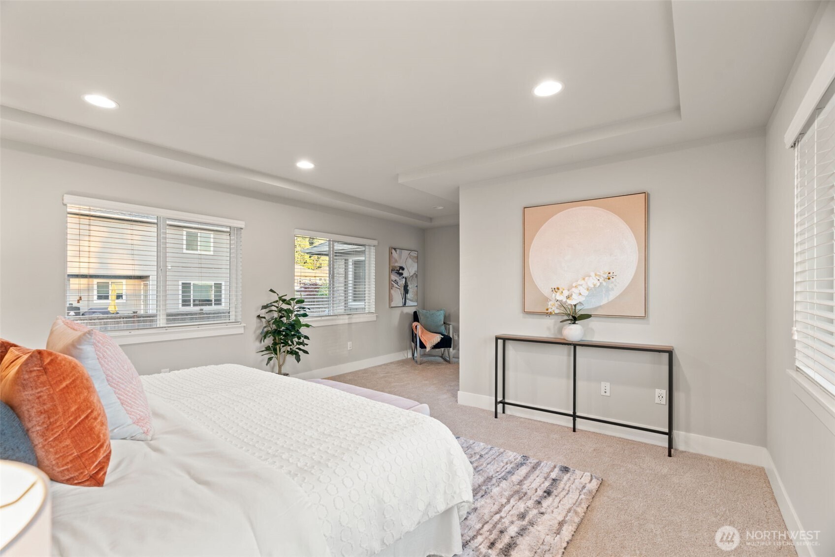 4408 214th Place Southeast Bothell, WA 98021 - Photo 28 of 33 a spacious bedroom with a large bed and a chandelier