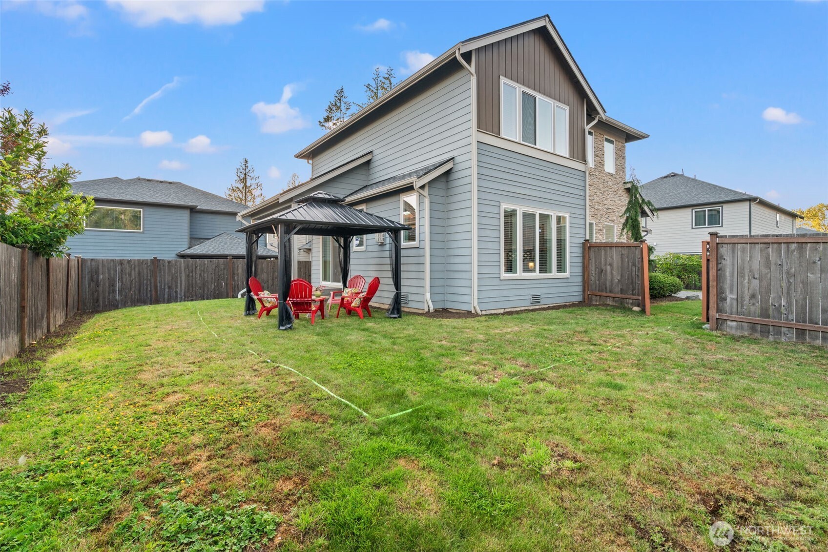 4408 214th Place Southeast Bothell, WA 98021 - Photo 30 of 33 a backyard of a house with table and chairs