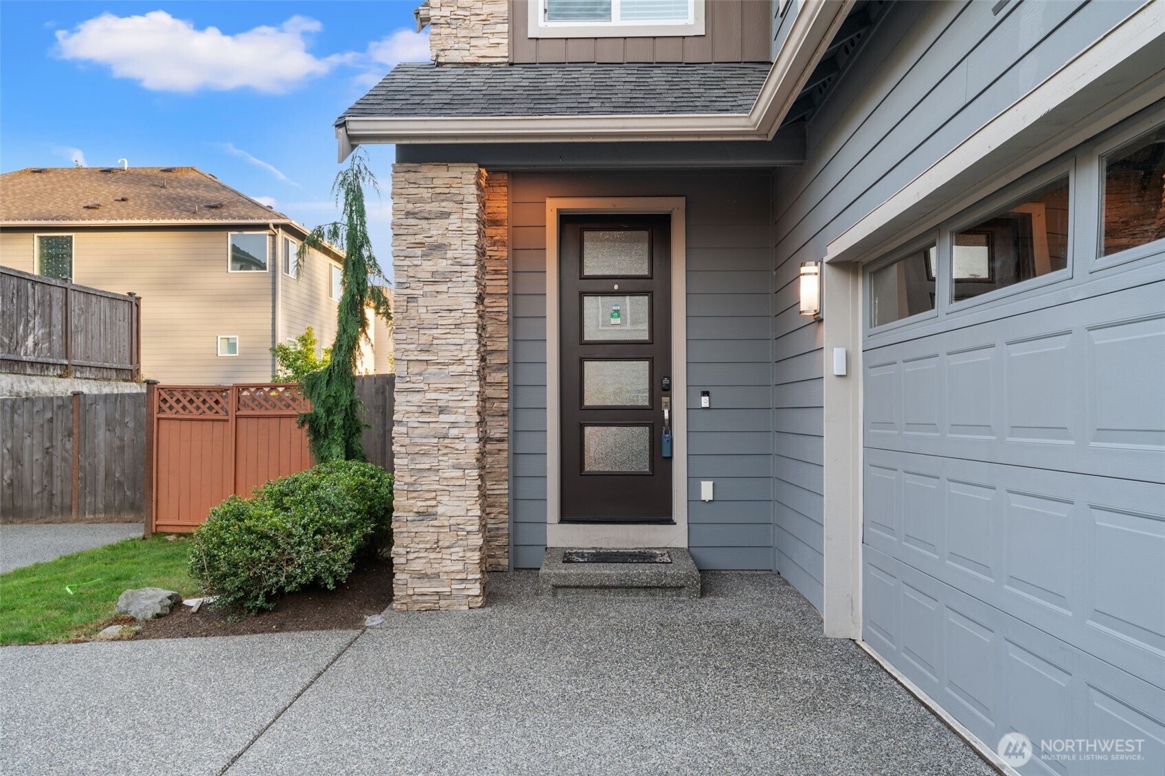 4408 214th Place Southeast Bothell, WA 98021 - Photo 7 of 33 a front view of a house with a garden
