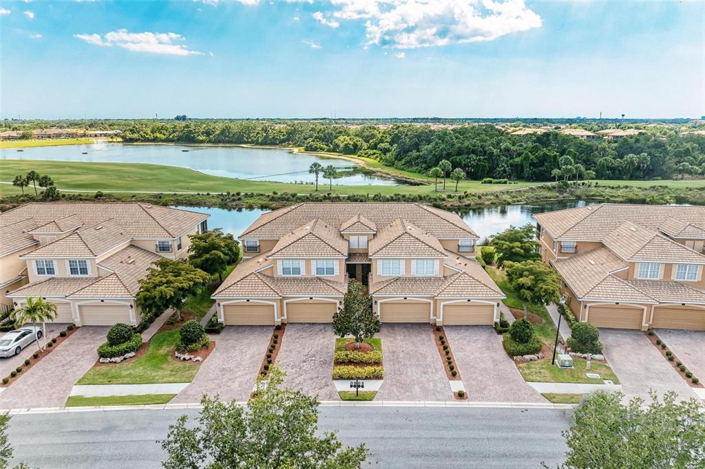 an aerial view of a house with garden space and ocean view