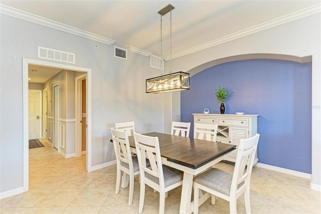 424 Winding Brook Lane, Unit 104 Bradenton, FL 34212 - Photo 17 of 72 a view of a dining room with furniture