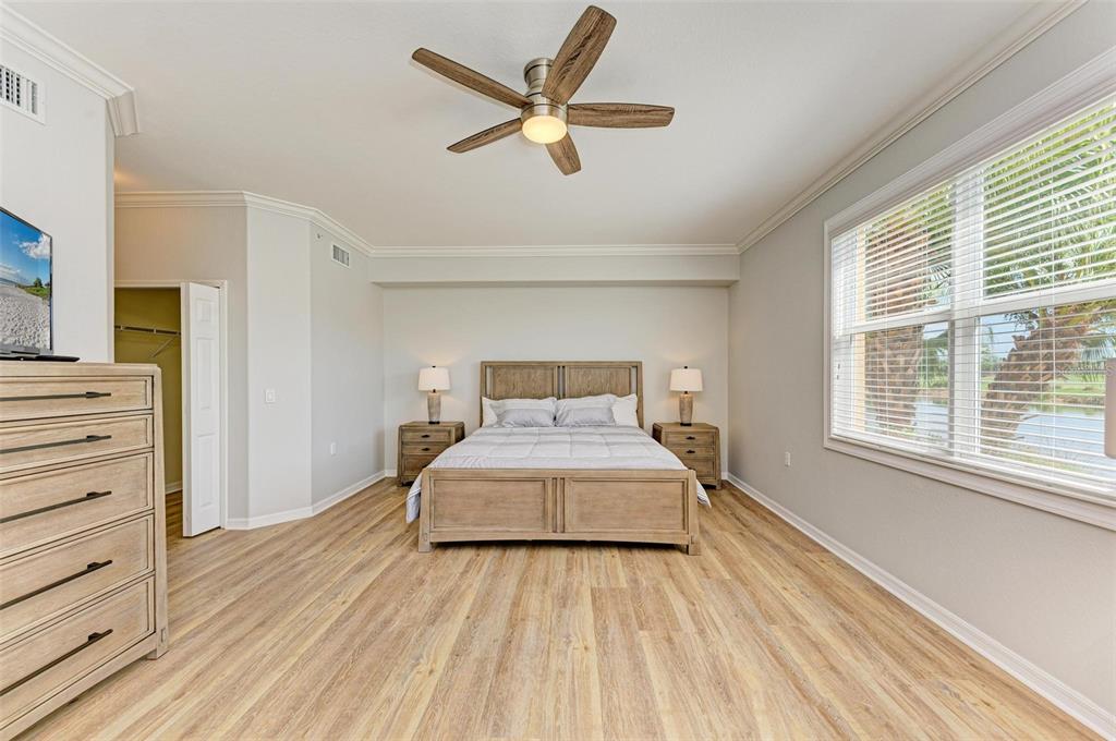 424 Winding Brook Lane, Unit 104 Bradenton, FL 34212 - Photo 18 of 72 a bedroom with a bed and window