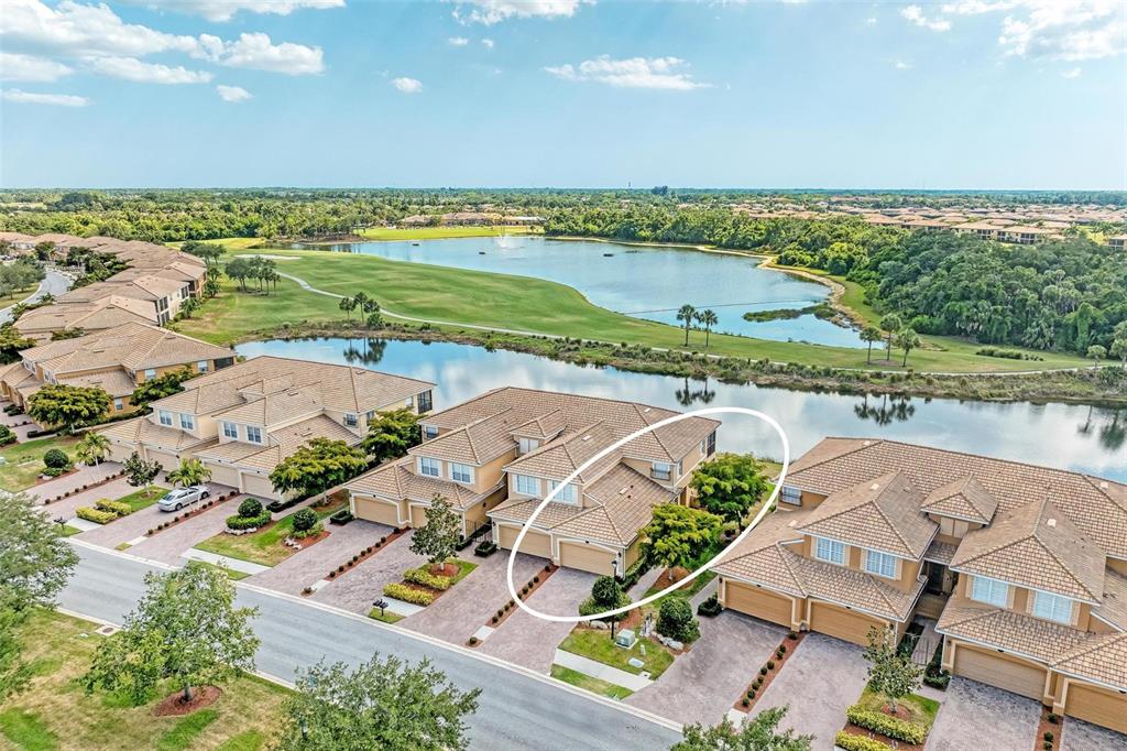 424 Winding Brook Lane, Unit 104 Bradenton, FL 34212 - Photo 2 of 72 a view of a city with an ocean