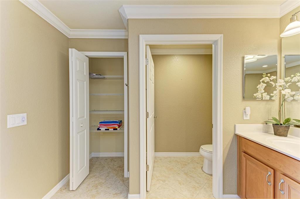 424 Winding Brook Lane, Unit 104 Bradenton, FL 34212 - Photo 23 of 72 a bathroom with a sink and a mirror