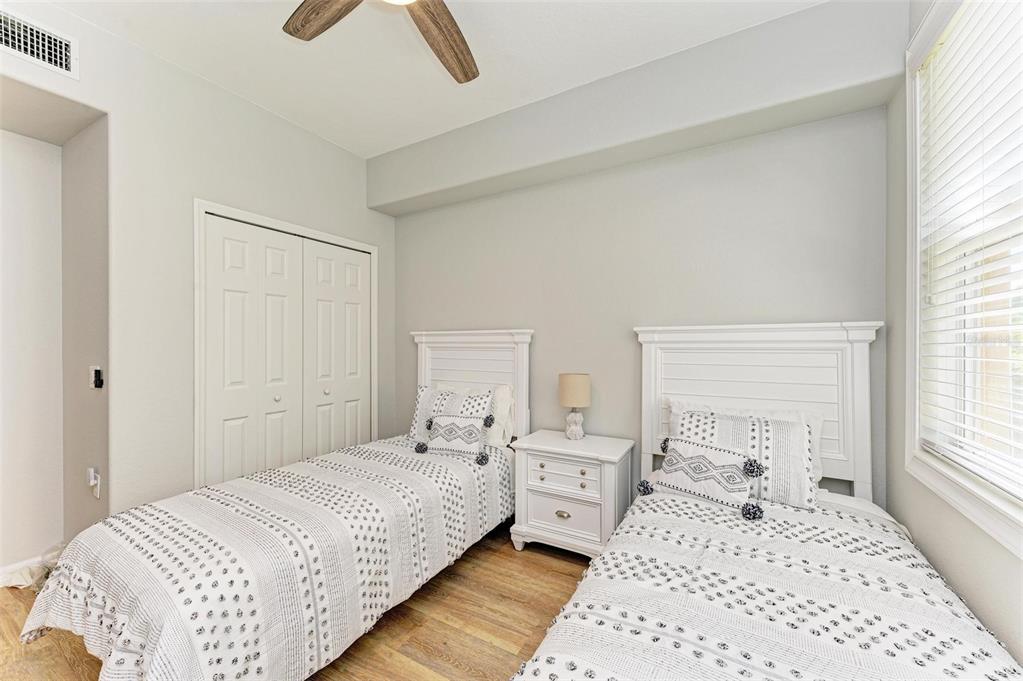424 Winding Brook Lane, Unit 104 Bradenton, FL 34212 - Photo 26 of 72 a bedroom with a bed and a window