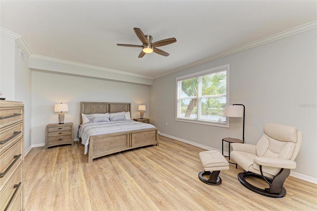 424 Winding Brook Lane, Unit 104 Bradenton, FL 34212 - Photo 32 of 72 a bedroom with a bed and window