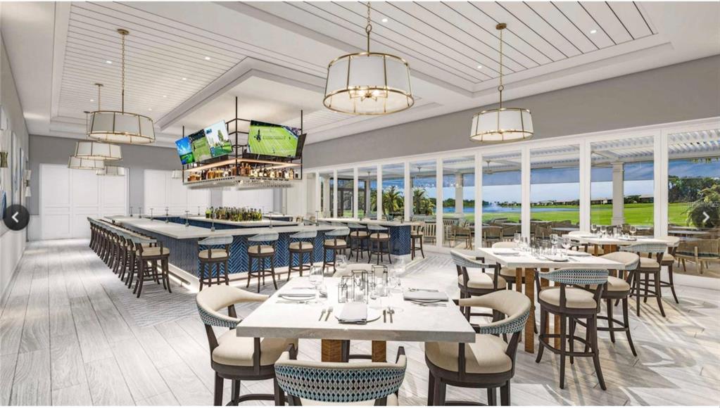 424 Winding Brook Lane, Unit 104 Bradenton, FL 34212 - Photo 38 of 72 a view of a dining room with furniture window and wooden floor