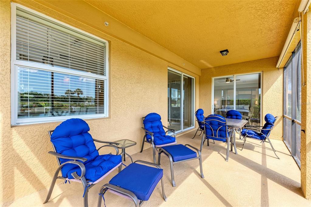 424 Winding Brook Lane, Unit 104 Bradenton, FL 34212 - Photo 7 of 72 a living room with furniture and a window