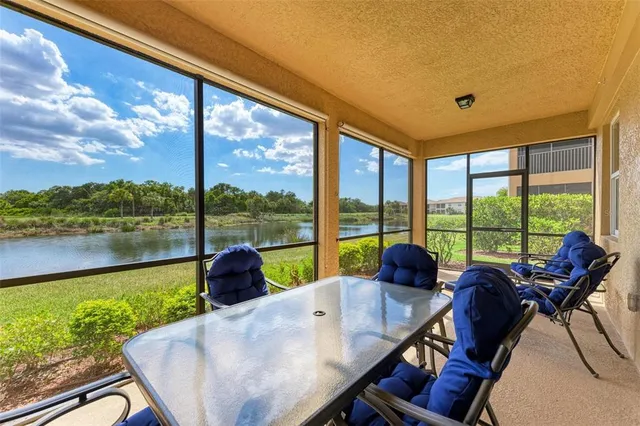 a kitchen with stainless steel appliances granite countertop a refrigerator oven a sink dishwasher and wooden cabinets with wooden floor