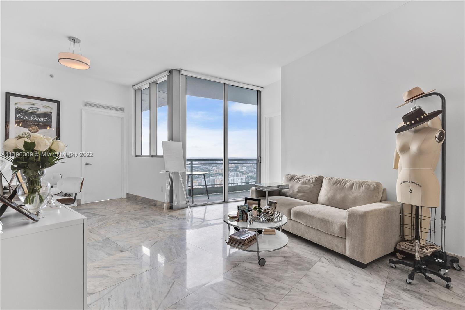 92 Southwest 3rd Street, Unit 5106 Miami, FL 33130 - Photo 1 of 36 a living room with furniture and a window