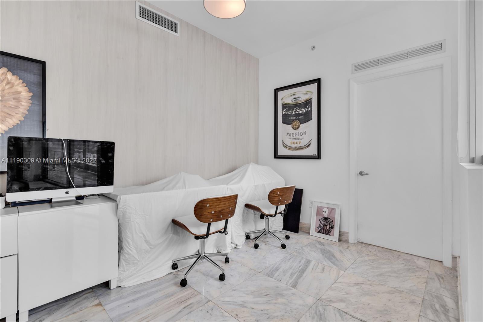 92 Southwest 3rd Street, Unit 5106 Miami, FL 33130 - Photo 15 of 36 a view of a workspace with furniture and a window