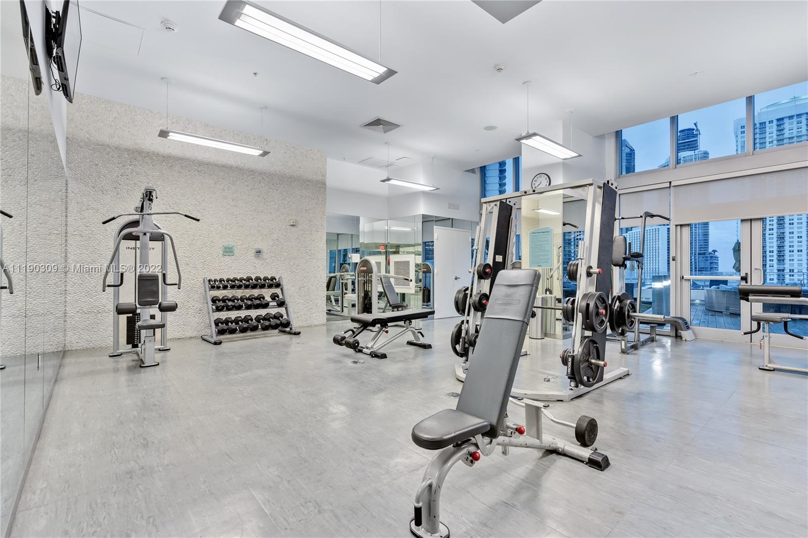 92 Southwest 3rd Street, Unit 5106 Miami, FL 33130 - Photo 29 of 36 a view of a room with gym equipment