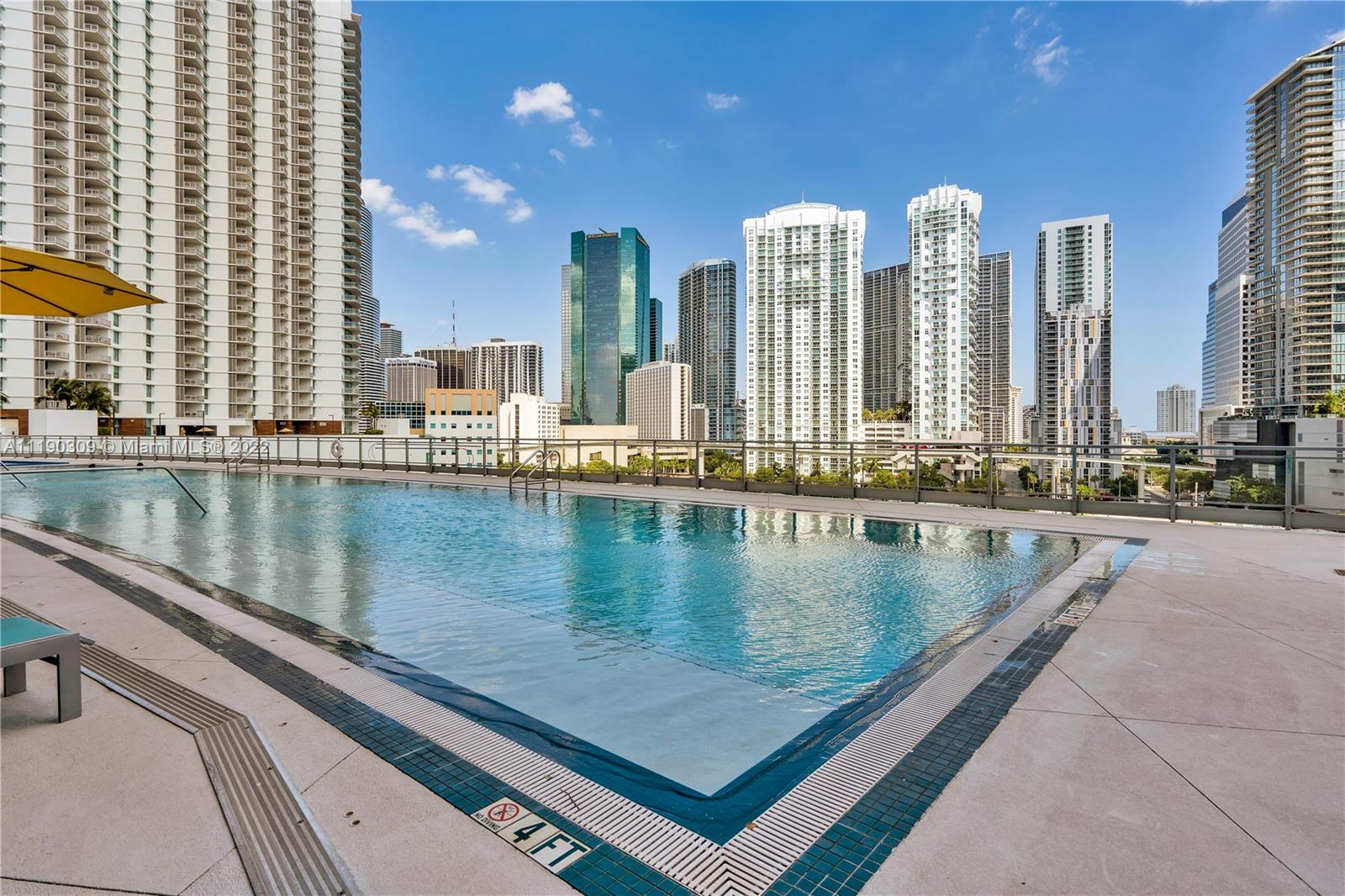 92 Southwest 3rd Street, Unit 5106 Miami, FL 33130 - Photo 32 of 36 a view of swimming pool with outdoor seating and city view