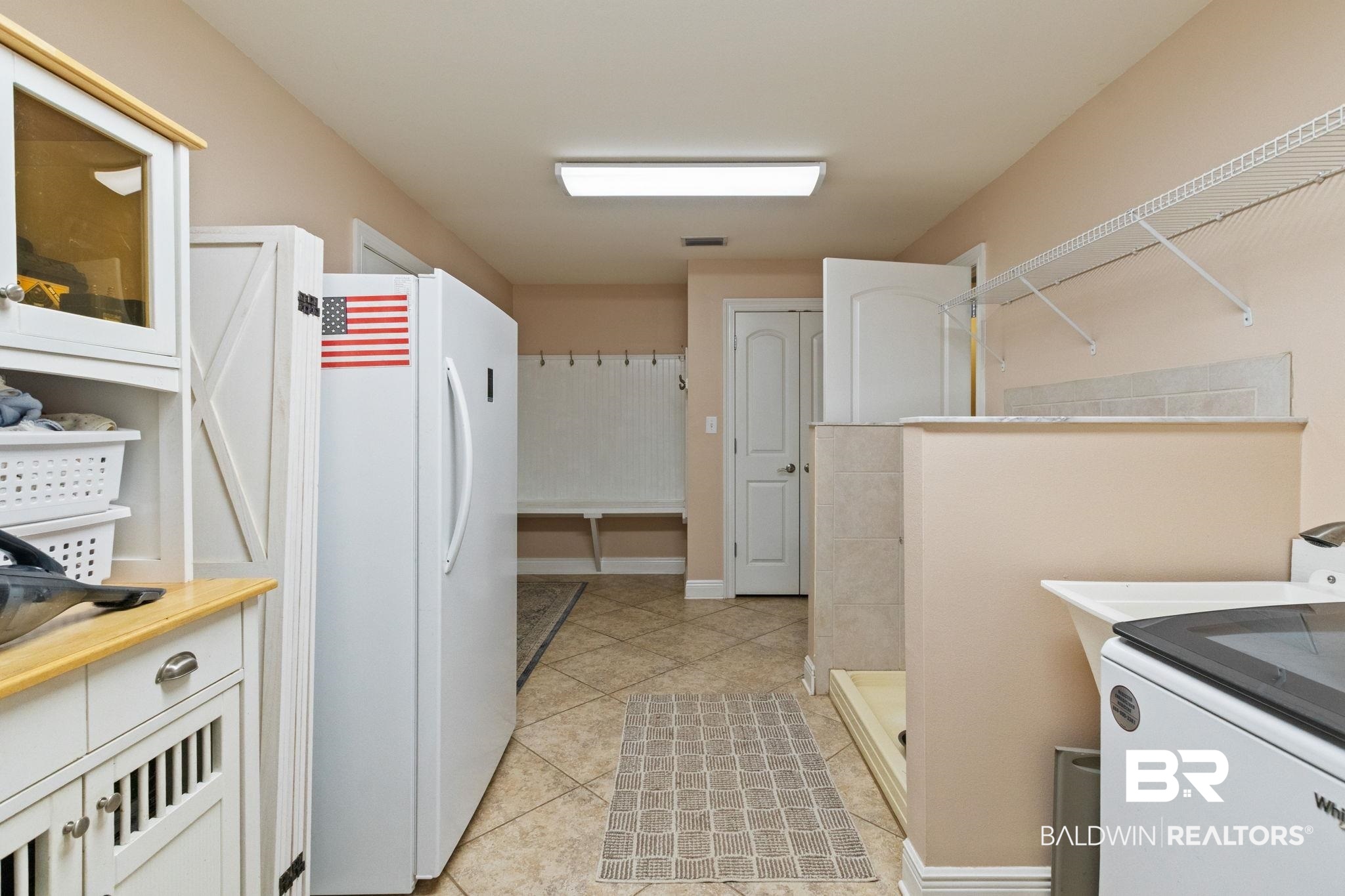 24250 Hack Road Bay Minette, AL 36507 - Photo 39 of 88 Laundry area with washer / clothes dryer and light tile patterned floors