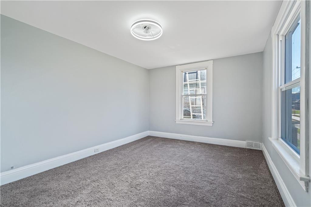 726 Market Street, Unit 3 Beaver, PA 15009 - Photo 14 of 24 wooden floor in an empty room with a window
