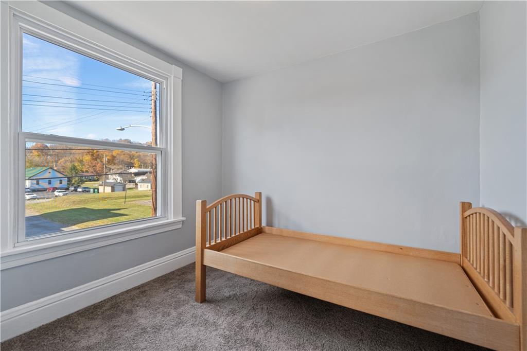 726 Market Street, Unit 3 Beaver, PA 15009 - Photo 19 of 24 a bedroom with a bed and a window