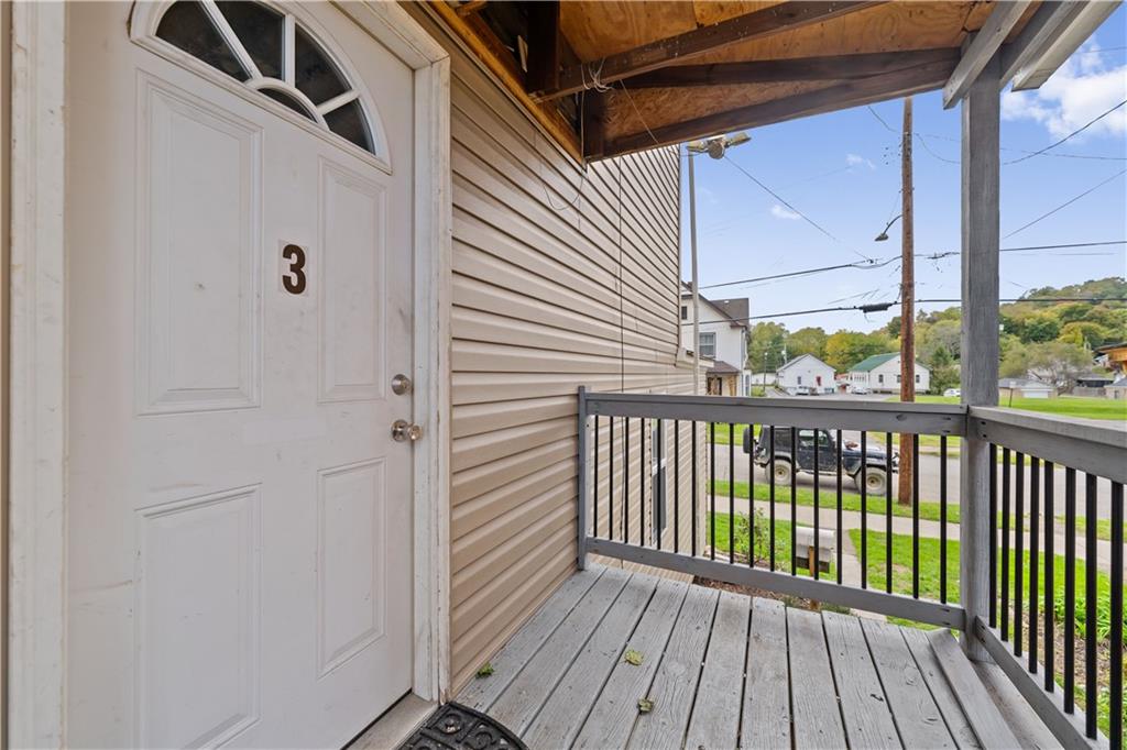 726 Market Street, Unit 3 Beaver, PA 15009 - Photo 3 of 24 a view of a balcony with wooden floor