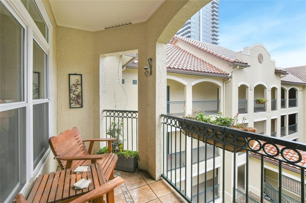 955 Juniper Street Northeast, Unit 4324 Atlanta, GA 30309 - Photo 1 of 26 a view of a balcony with furniture