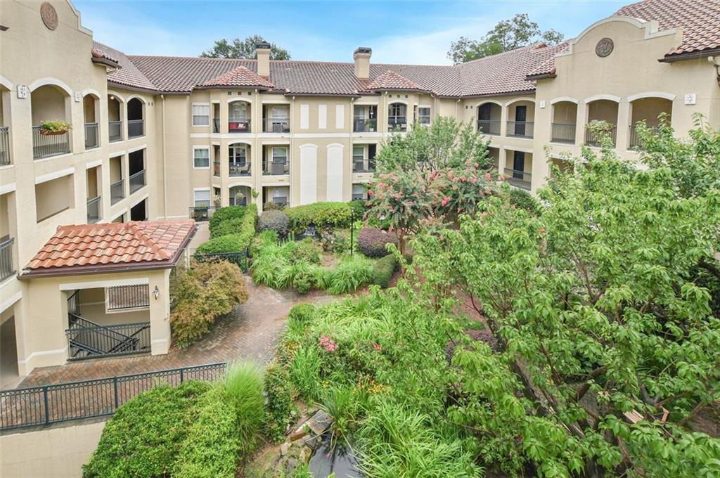 955 Juniper Street Northeast, Unit 4324 Atlanta, GA 30309 - Photo 19 of 26 a front view of a residential apartment building with a yard
