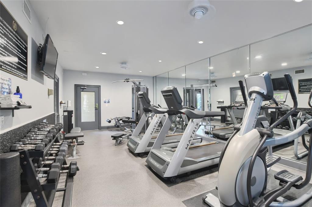 955 Juniper Street Northeast, Unit 4324 Atlanta, GA 30309 - Photo 23 of 26 a view of a room with gym equipment