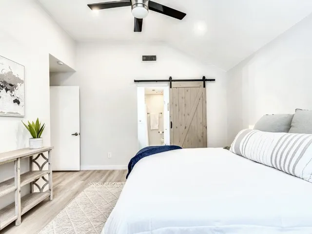 a bedroom with a bed and a dresser