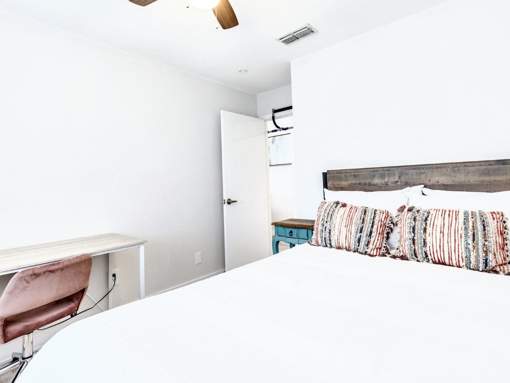 14205 Vandever Street Austin, TX 78725 - Photo 15 of 23 a bedroom with a bed and a window