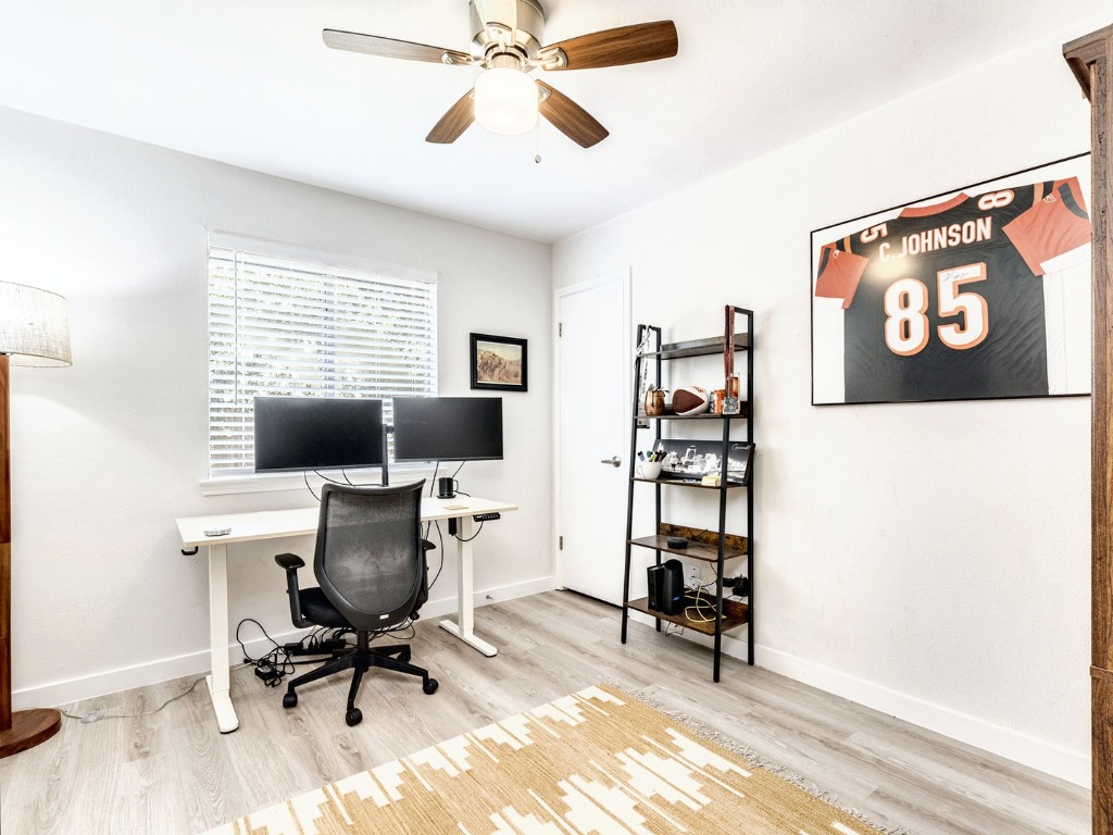 14205 Vandever Street Austin, TX 78725 - Photo 16 of 23 a view of a workspace with furniture and a window
