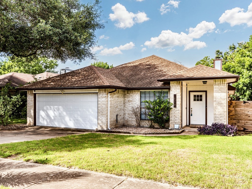 14205 Vandever Street Austin, TX 78725 - Photo 2 of 23 a view of a house with a swimming pool and a yard with plants