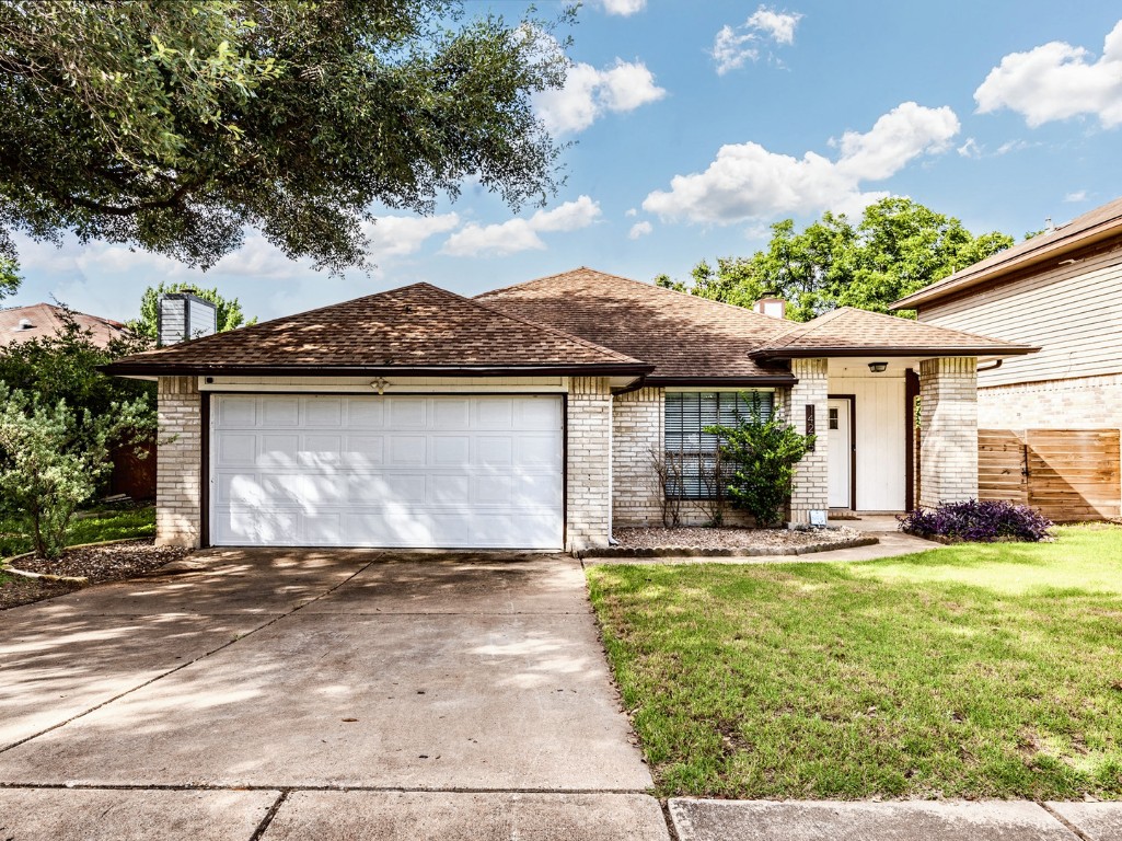 14205 Vandever Street Austin, TX 78725 - Photo 23 of 23 a front view of a house with a yard