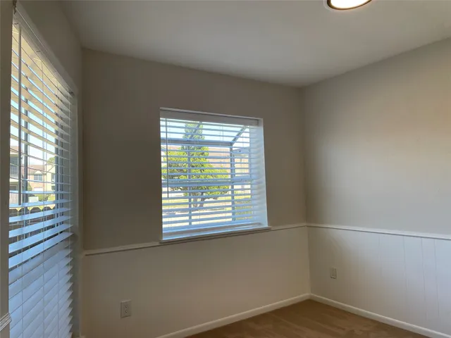 a view of a room that has a window in it