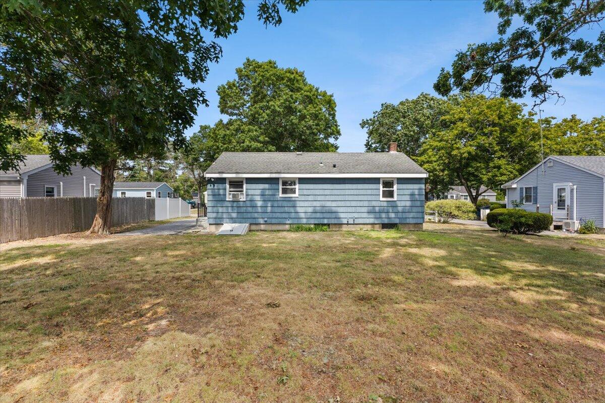 74 Fearing Street Buzzards Bay, MA 02532 - Photo 6 of 32 a house view with a swimming pool