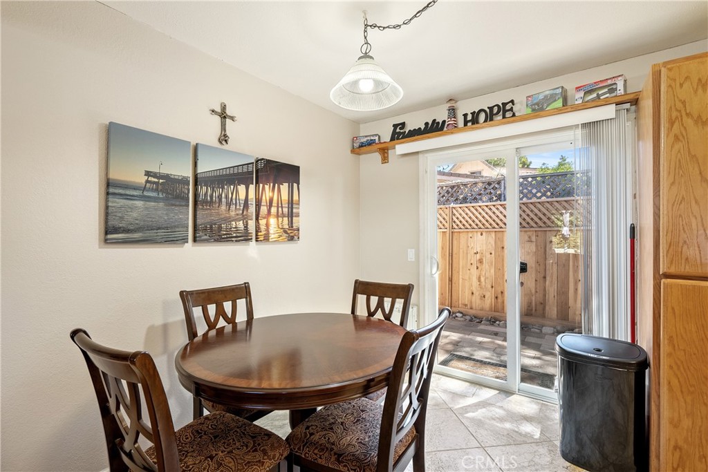 1747 Brighton Avenue Grover Beach, CA 93433 - Photo 13 of 50 a view of a dining room with furniture window and wooden floor