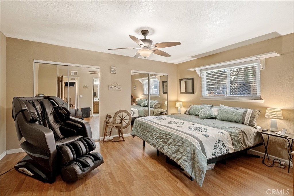 1747 Brighton Avenue Grover Beach, CA 93433 - Photo 15 of 50 a bedroom with a bed and wooden floor