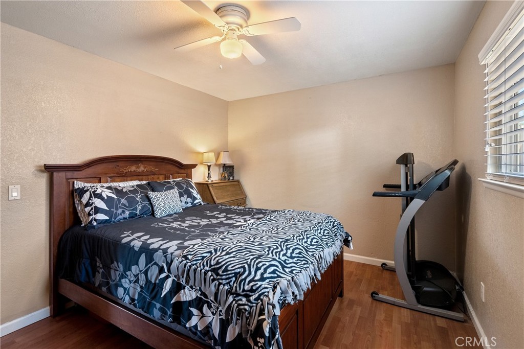 1747 Brighton Avenue Grover Beach, CA 93433 - Photo 19 of 50 a bedroom with a bed and wooden floor