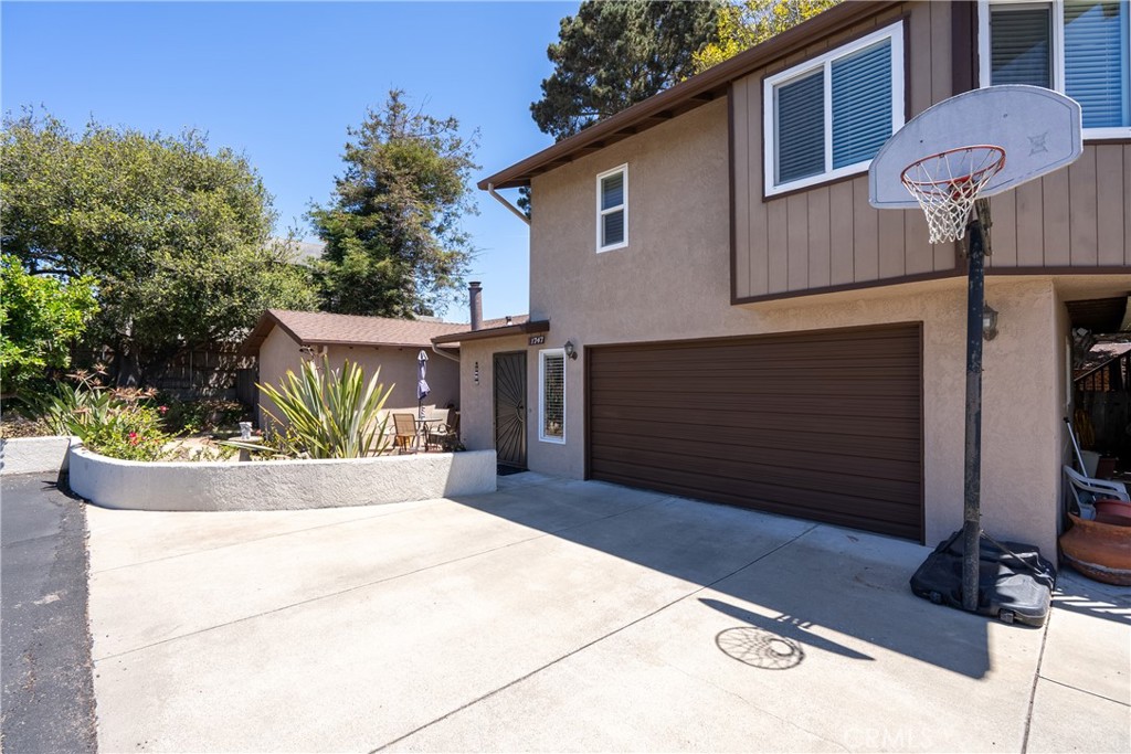 1747 Brighton Avenue Grover Beach, CA 93433 - Photo 3 of 50 a view of a house with a yard