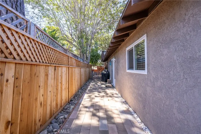 a view of a porch with furniture and a yard