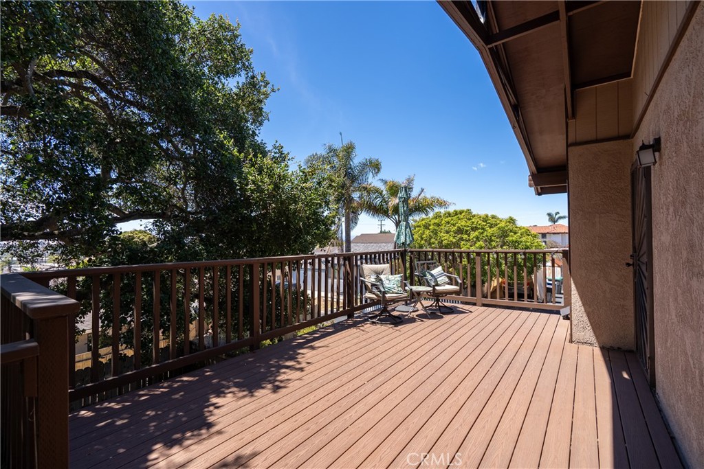 1747 Brighton Avenue Grover Beach, CA 93433 - Photo 40 of 50 a balcony with wooden floor