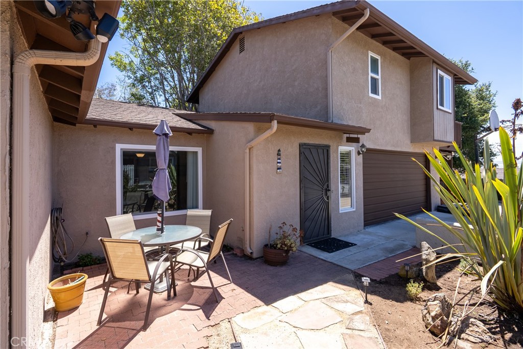 1747 Brighton Avenue Grover Beach, CA 93433 - Photo 43 of 50 a backyard of a house with table and chairs