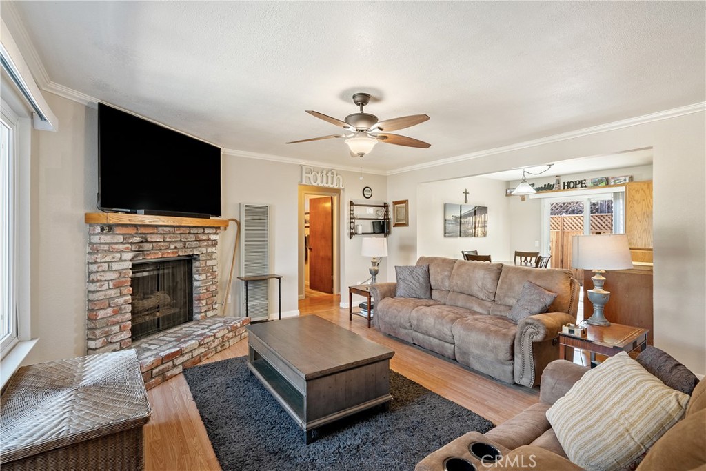 1747 Brighton Avenue Grover Beach, CA 93433 - Photo 5 of 50 a living room with furniture a fireplace and a flat screen tv