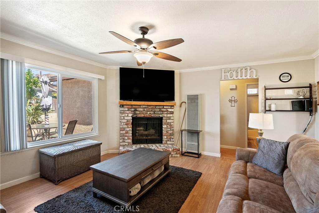 1747 Brighton Avenue Grover Beach, CA 93433 - Photo 6 of 50 a living room with furniture and a fireplace