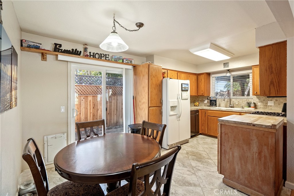 1747 Brighton Avenue Grover Beach, CA 93433 - Photo 8 of 50 a large kitchen with a table and chairs