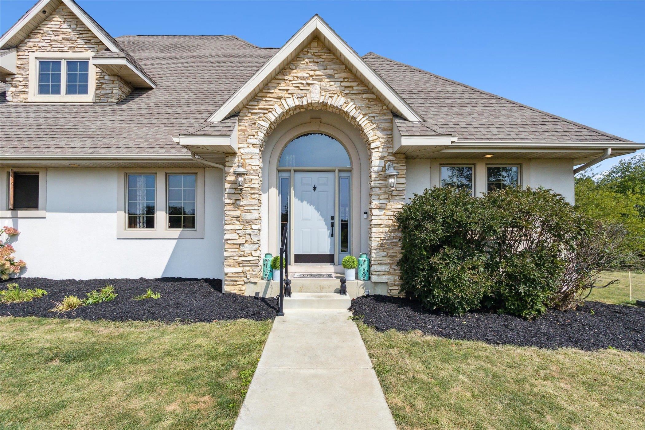 638 West Cedarville Road Freeport, IL 61032 - Photo 3 of 51 a front view of a house with garden