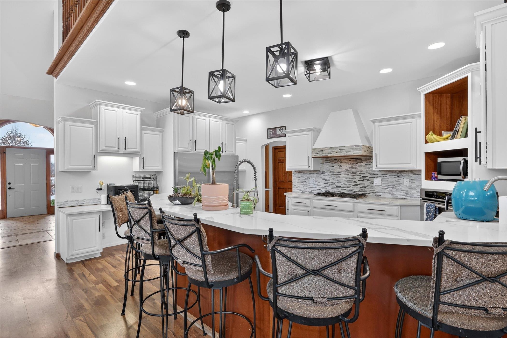 638 West Cedarville Road Freeport, IL 61032 - Photo 36 of 51 a kitchen with stainless steel appliances kitchen island granite countertop a dining table chairs and sink