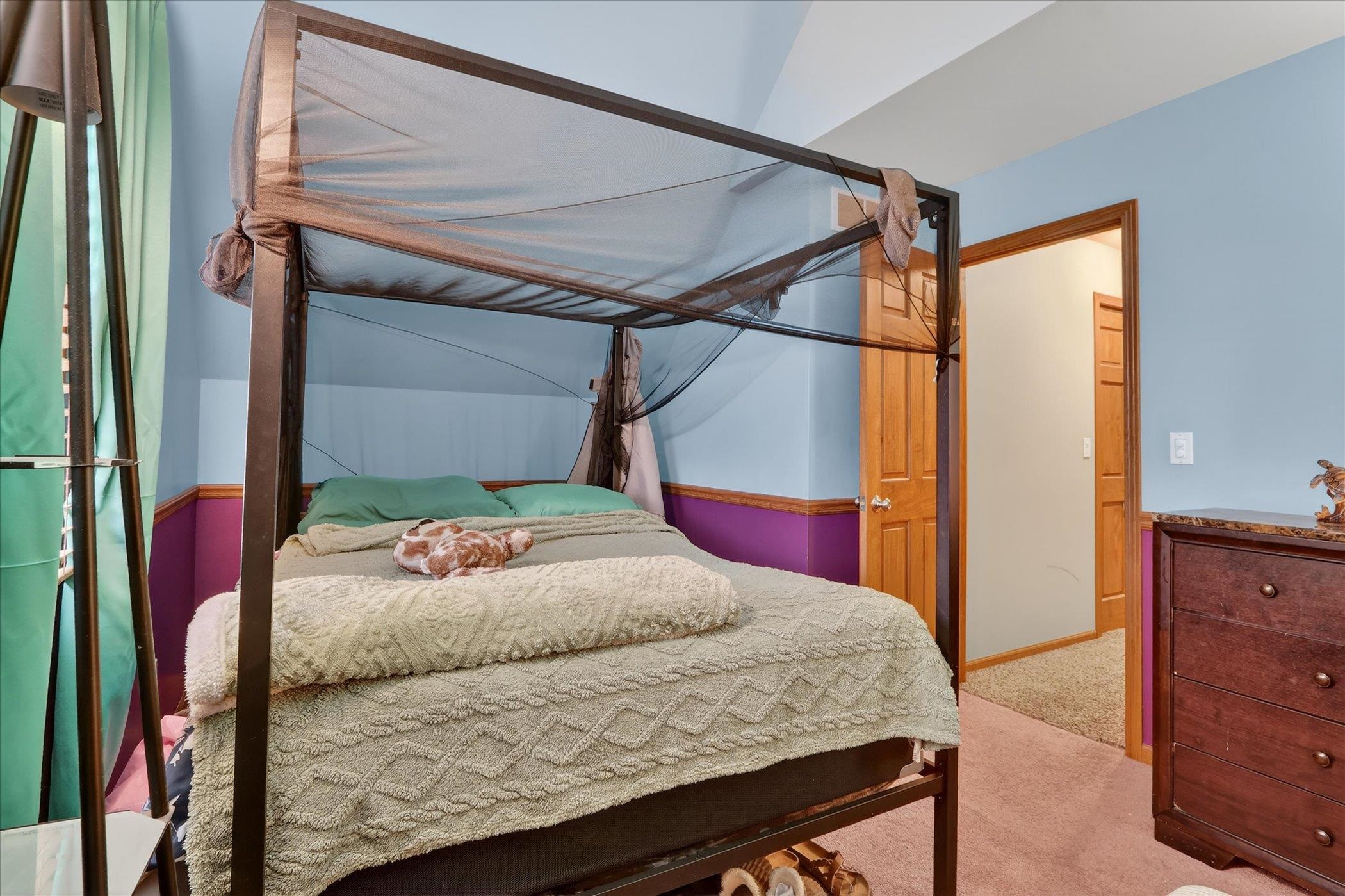 638 West Cedarville Road Freeport, IL 61032 - Photo 41 of 51 a bedroom with a bed and a dresser