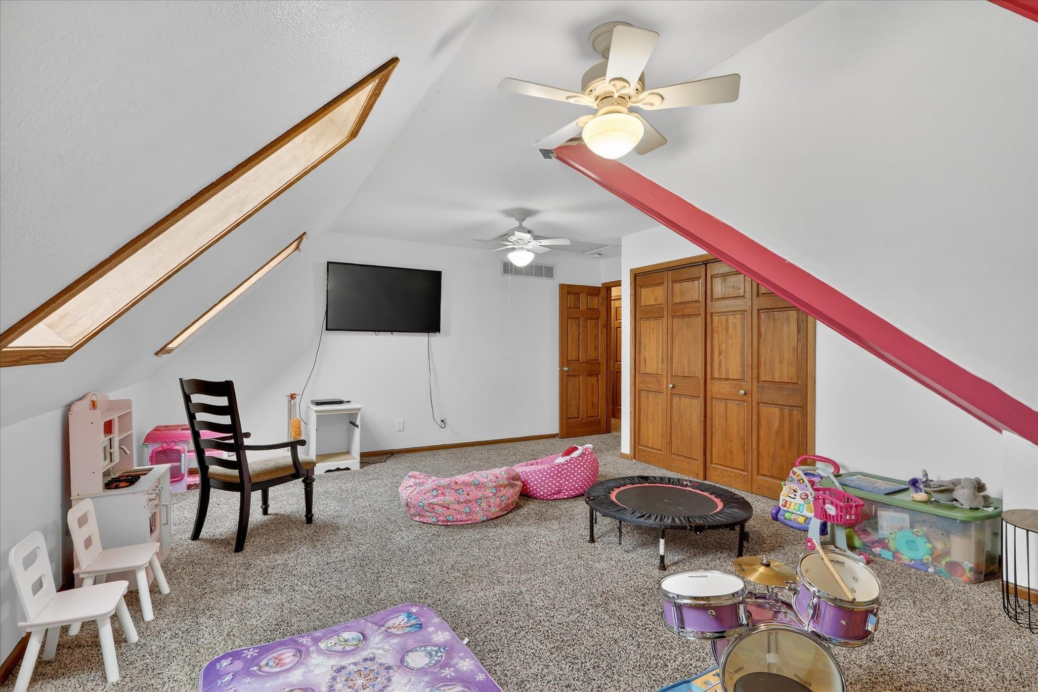 638 West Cedarville Road Freeport, IL 61032 - Photo 45 of 51 a bedroom with furniture and a flat screen tv