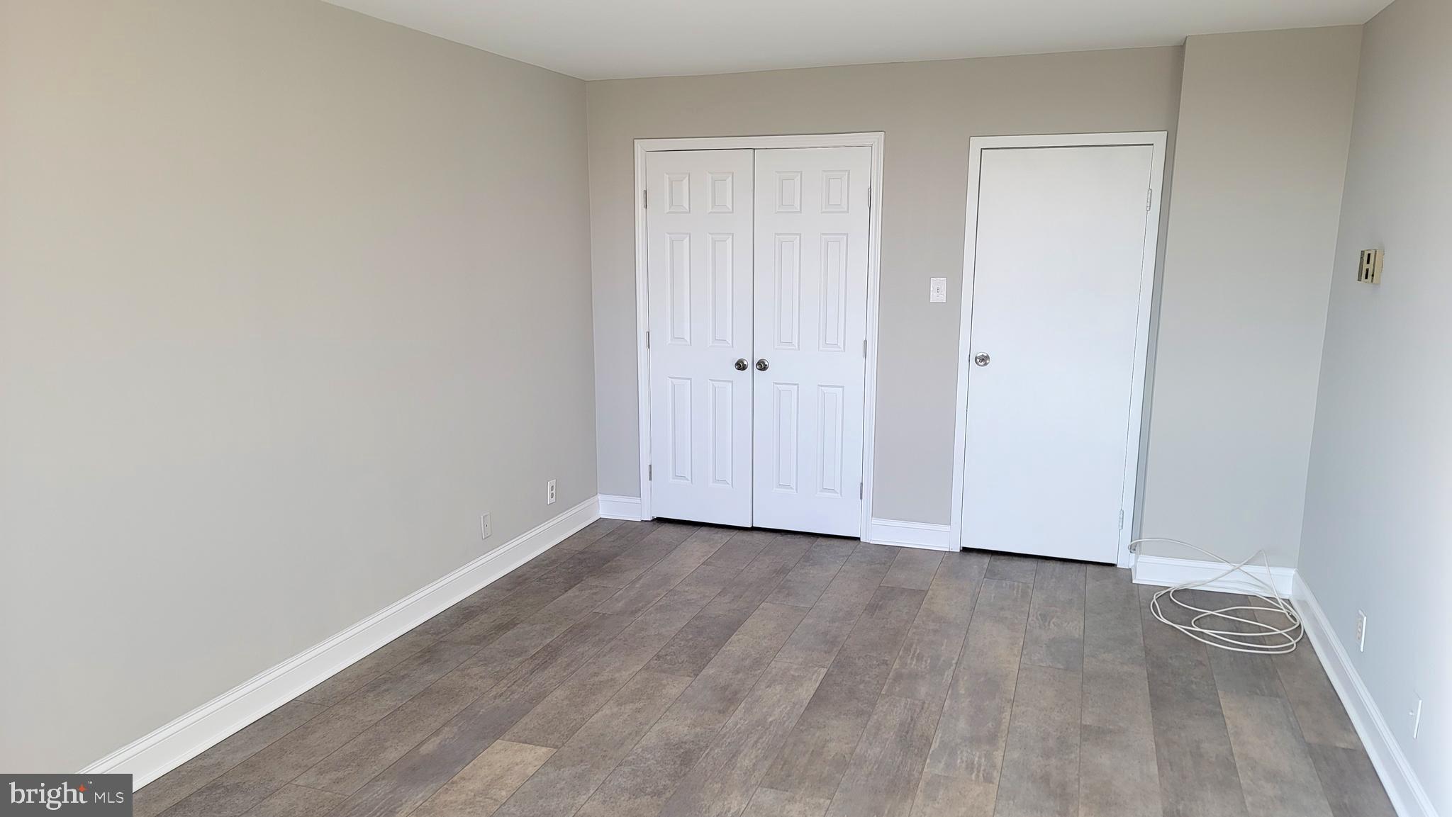 301 North Beauregard Street, Unit 903 Alexandria, VA 22312 - Photo 12 of 19 a view of an empty room with wooden floor
