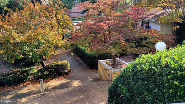 an aerial view of a house with a yard and garden